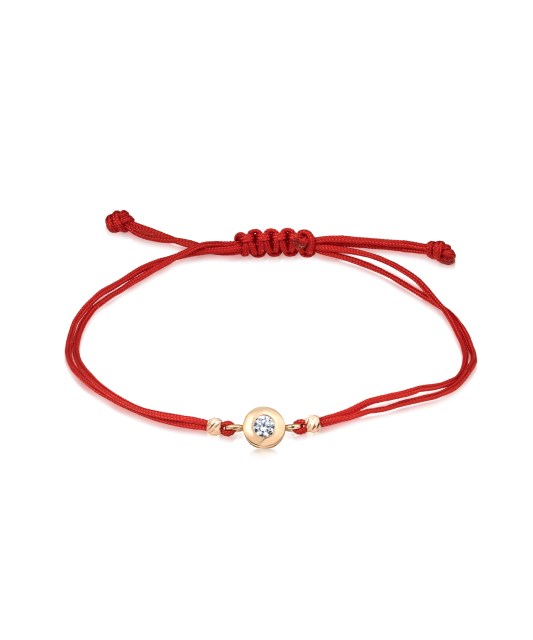 Punasest lõngast käevõru kulla tsirkoonist ripatsiga