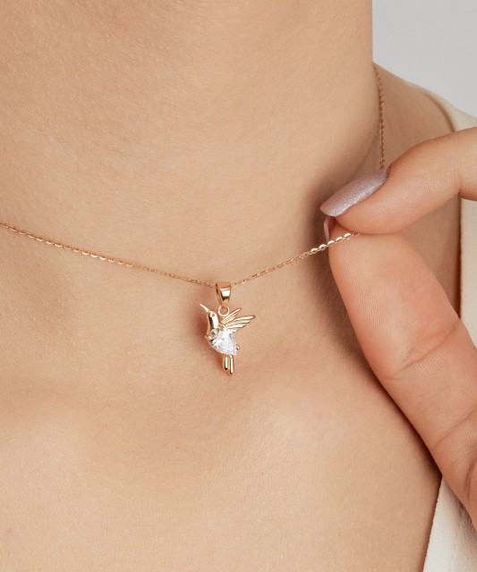 Kuldripats tsirkooniga "koolibri"