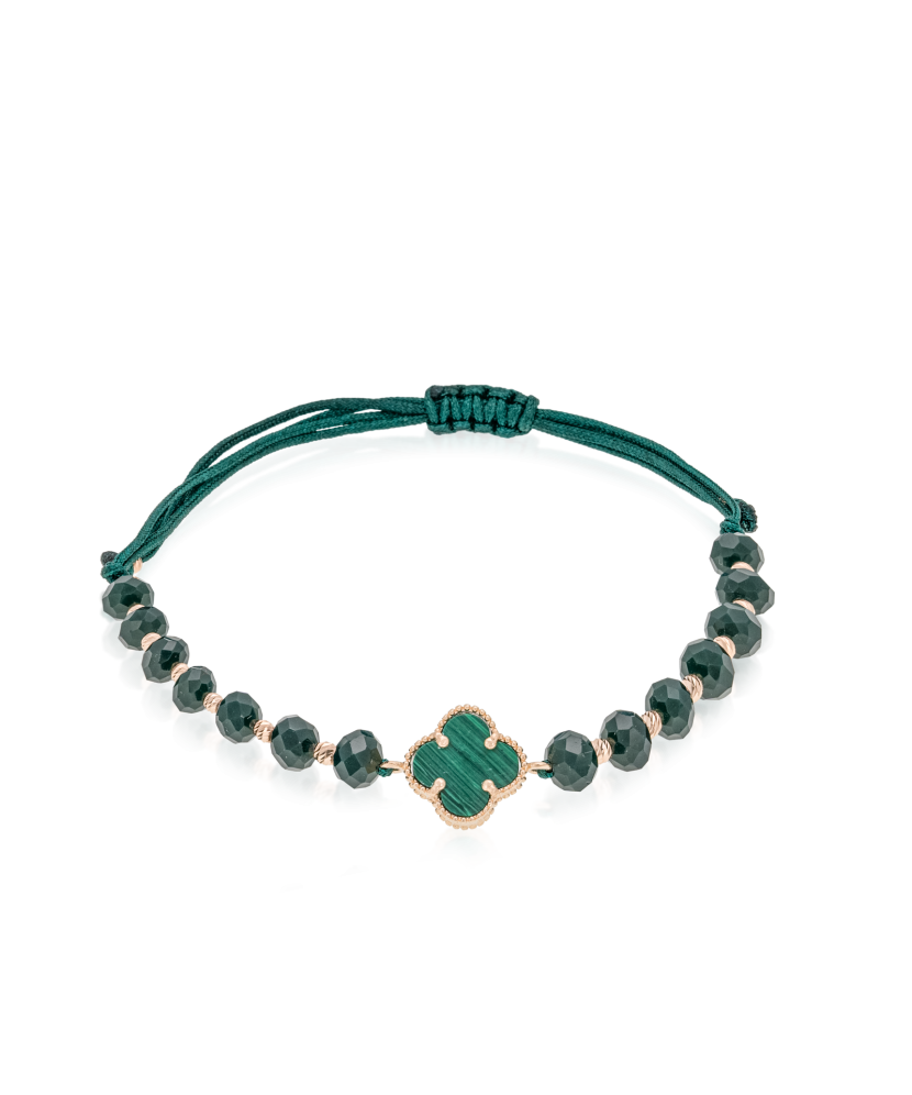 Rohelisest lõngast käevõru kulla ja oonüksitega