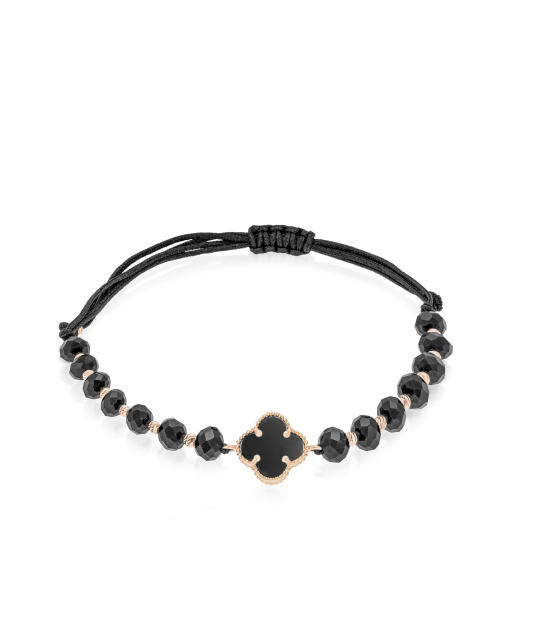 Mustast lõngast käevõru kulla ja oonüksitega