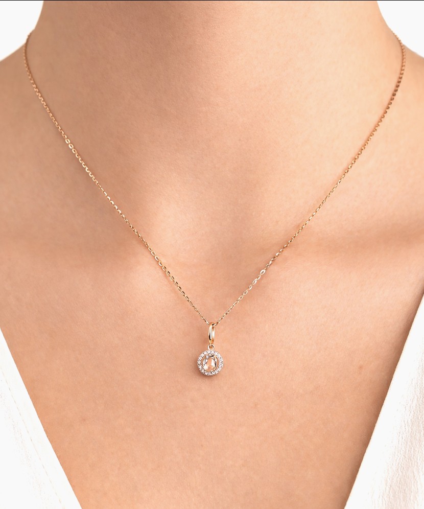 Kuldne ripats valge topaasi ja teemantidega