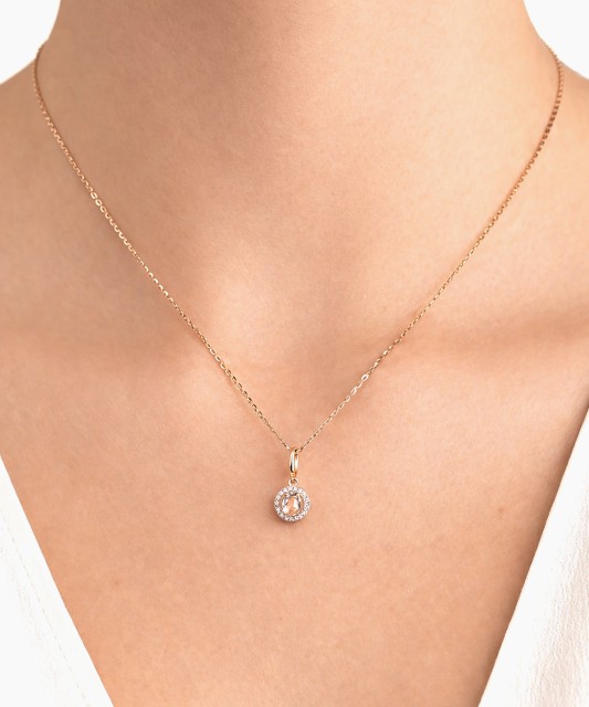 Kuldne ripats valge topaasi ja teemantidega