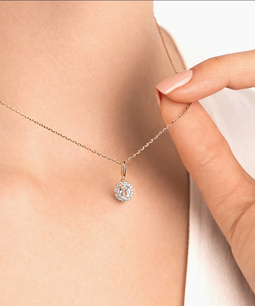 Kuldne ripats valge topaasi ja teemantidega