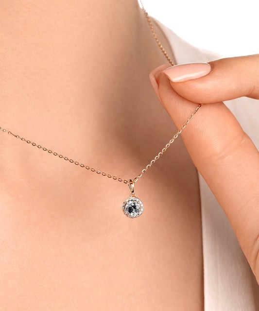 Kuldne ripats valge topaasi ja teemantidega