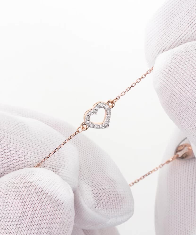 Kuldne käevõru teemantidega "süda"