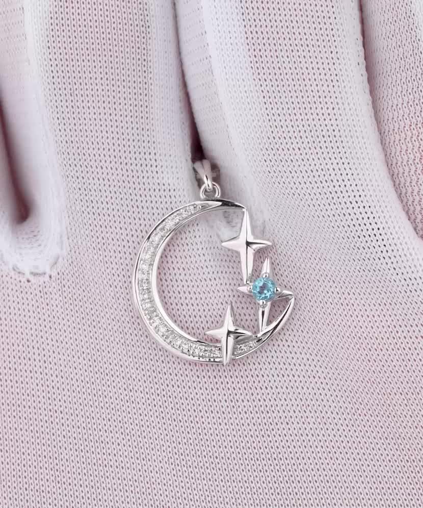 Valgest kullast ripats teemantide ja topaasiga