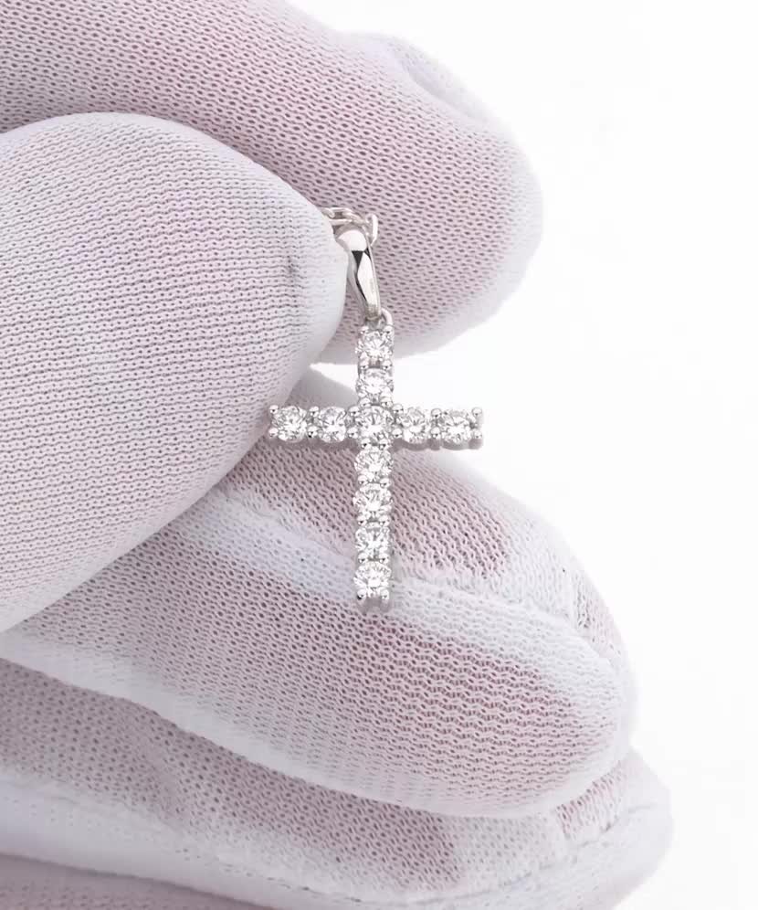 Valgest kullast ripats teemantidega "Rist"