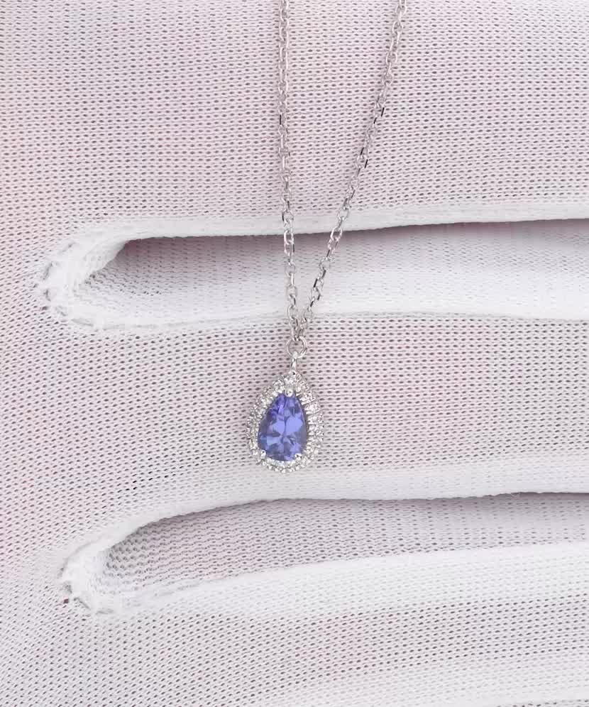 Valgest kullast kett tanzaniidi ja teemantidega ripatsiga