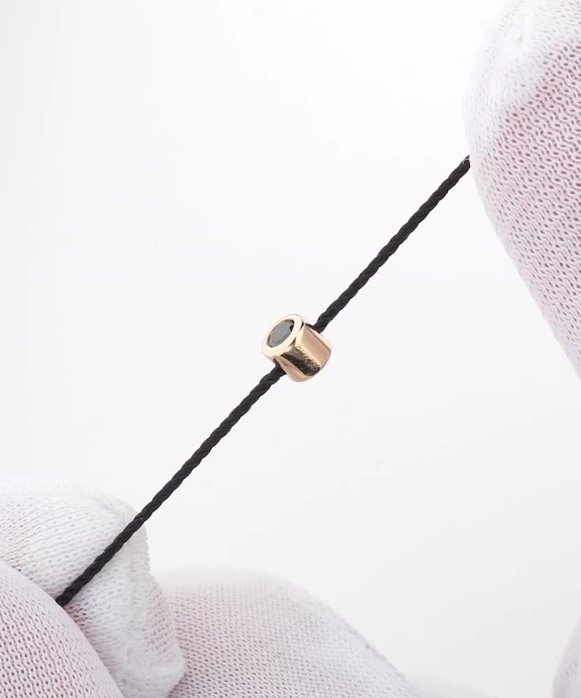 Musta niidiga käevõru musta teemandi ja kollase kullaga