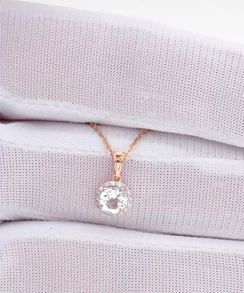 Kuldne ripats valge topaasi ja teemantidega