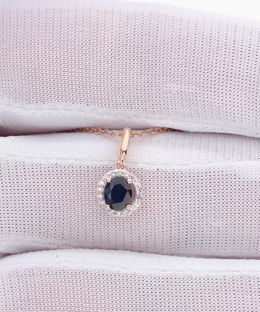 Kuldne ripats safiiri ja teemantidega